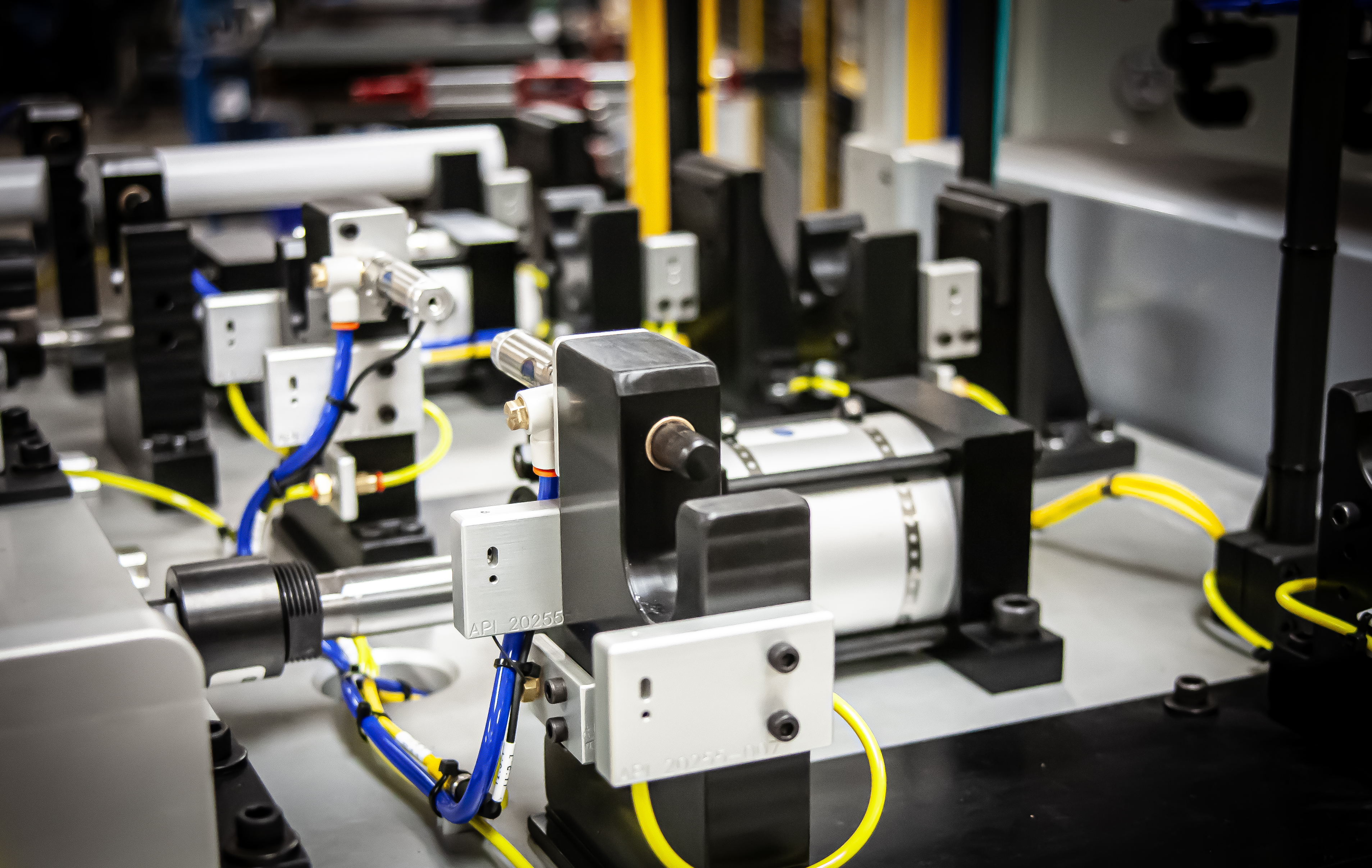 Custom pneumatic workholding fixture with precision locators and color-coded air lines